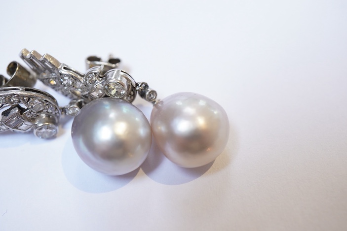 A fine pair of Art Deco natural pearl and diamond earrings, 1930s